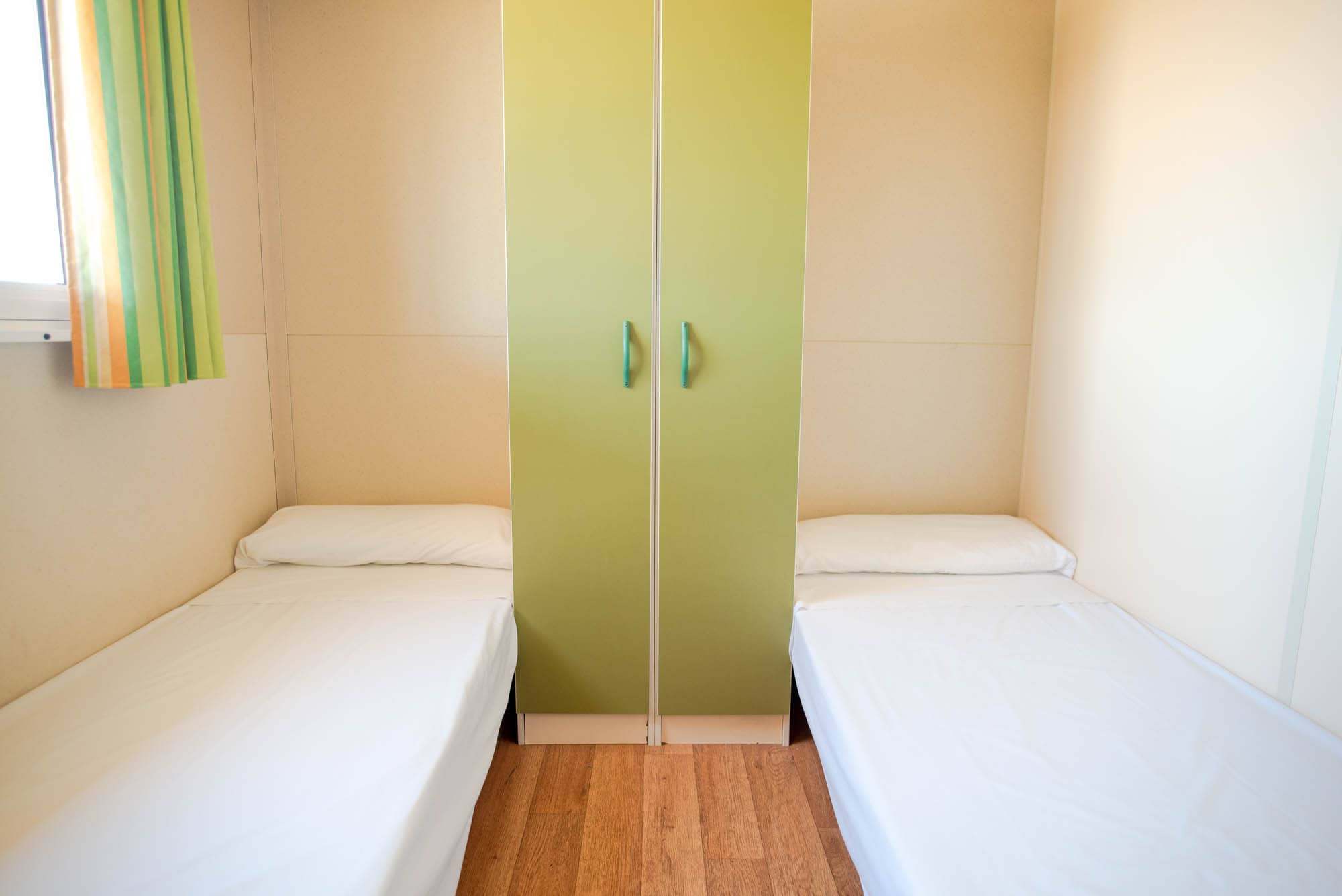 Camas individuales bungalow cabañeros
